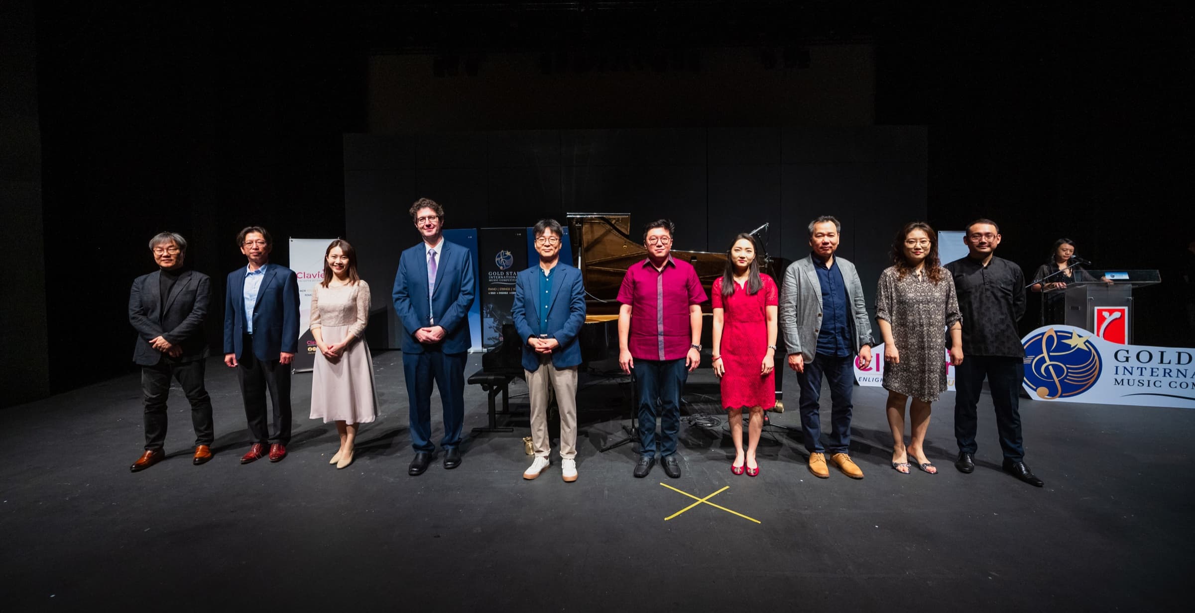 The adjudication panel gathers on stage at the 2024 Gold Star International Music Competition