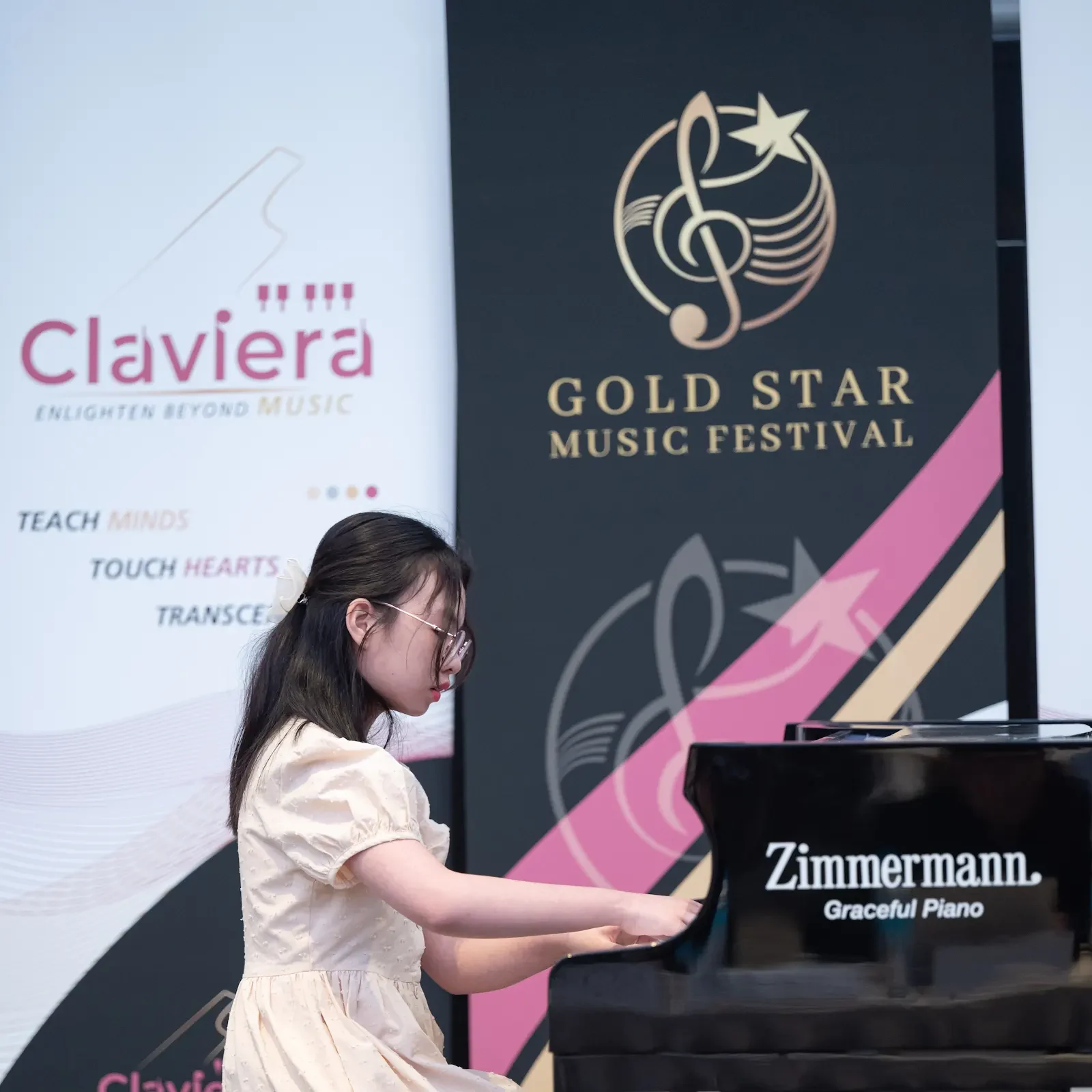 A young pianist performs at Gold Star Music Festival 2023