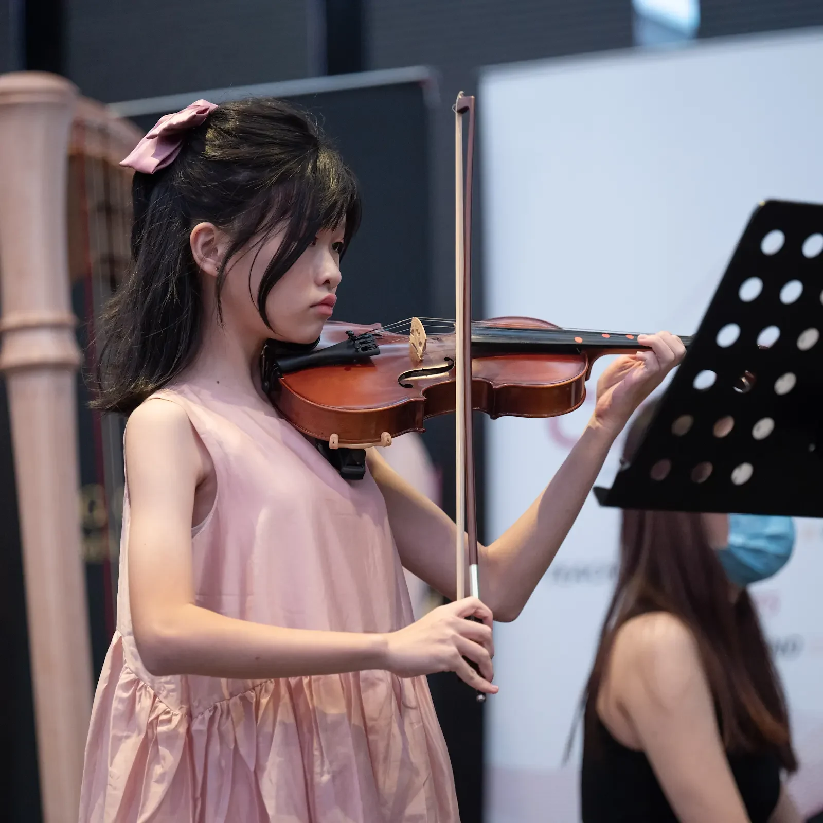 A young violinist performs at Gold Star Music Festival 2023
